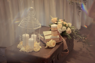 Wedding decor in warm tones with a cage for birds