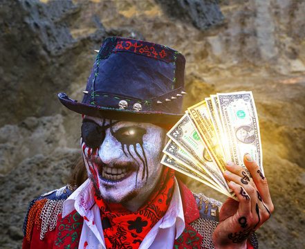 one-eyed pirate robber with eye patch and blood stains holds dollars, burning eye. Halloween. the concept of robbery, dirty dollars, sell your soul for money