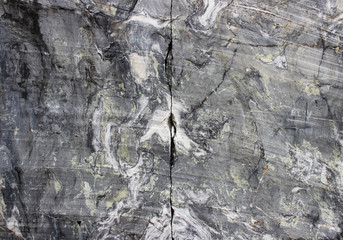 gray natural marble with white streaks in the canyon, deposit, Karelia.
