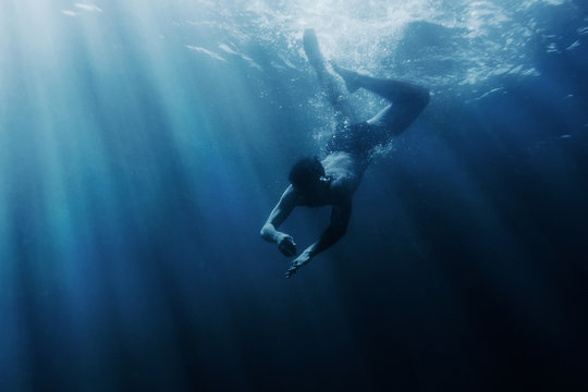 Man snorkeling underwater.