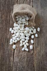 white butter beans on wooden surface