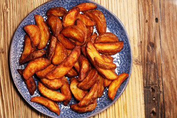 Baked potato wedges. homemade organic vegetable vegan vegetarian potato wedges snack food