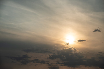 Cloudy sky at sunset. Beautiful clouds against bright sunset