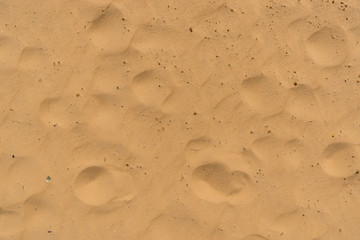 Abstract patterns on golden sand, beautiful background