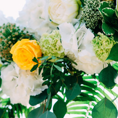 Outdoor wedding ceremony. Arch decorated with flowers and lace.
