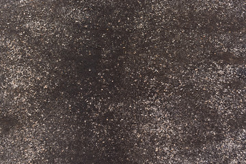 Black background. Detailed texture. Waterproofing with granite chips