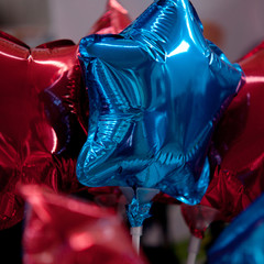 beautiful bright red and blue balloons in the form of stars