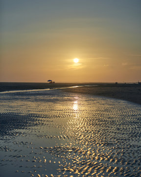 Photograph of a summer sunset on the beach of La Bota, Huelva