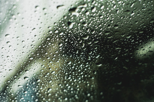 Close-up of wet windshield during rainy season