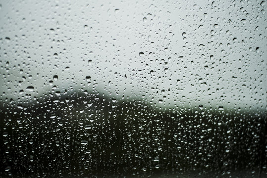 Close-up of wet window during rainy season - Powered by Adobe