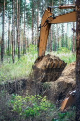 Excavator performs excavation work by digging the ground with a bucket