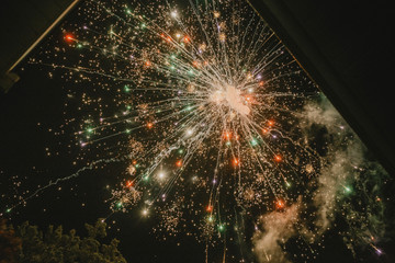 Low angle view of colorful firework display at night