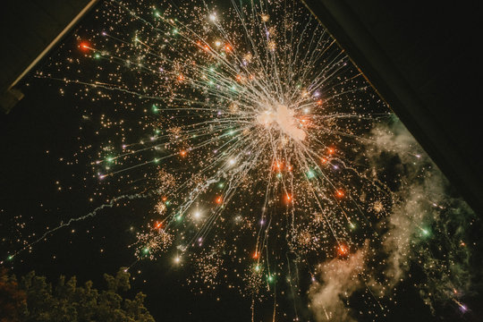 Low angle view of colorful firework display at night
