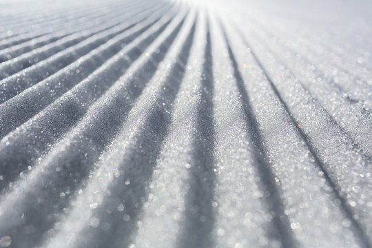 High angle view of snow covered field during sunny day