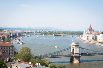 Fototapeta na wymiar Landscape of Parliament and Bridges across the Danube in Budapest, Hungary .