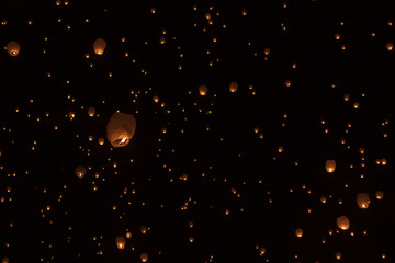 Low angle view of illuminated paper lanterns flying against sky at night during Chinese New Year