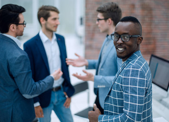 young businessman in front of his colleagues