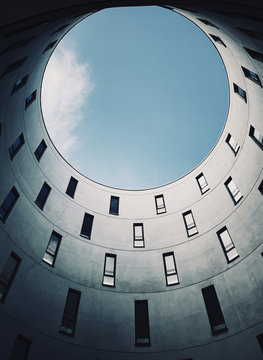Low angle view of windows in building against sky