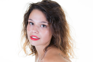 smiling happy girl with dark curly hair looking at camera with smile