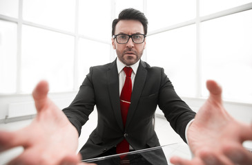 close up.serious businessman sitting at the office Desk
