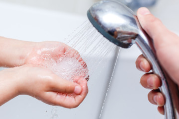 Fototapeta premium Children wash their hands