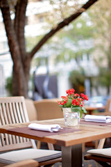 geranium on a table in a restaurant