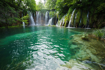 plitvice lakes waterfalls in forest