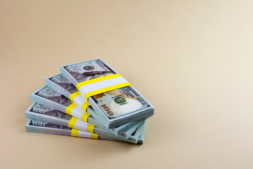 Many  bundle of US 100 dollars bank notes.  wealth, earning and savings concept.