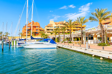 Sailing boats anchoring in Sotogrande marina with colorful houses, Andalusia, Spain © pkazmierczak