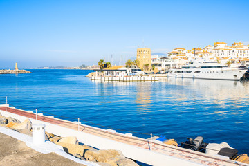 Fototapeta premium View of Puerto Banus marina with boats and white houses in Marbella town, Andalusia, Spain