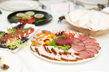 Meat assortment of beef, sausage and ham with greens