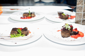 fried beef steaks with spices, on a white table