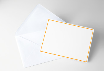 Blank card decorated with yellow frame and blue envelope