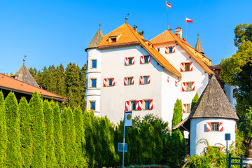 Fototapeta na wymiar White building of castle in Reith bei Kitzbuhel village on sunny summer day, Tyrol, Austria