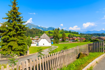 Fototapeta na wymiar Typical alpine village Reith bei Kitzbuhel in Alps mountains summer landscape on sunny day, Tirol, Austria