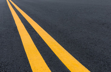 Asphalt road with pair of yellow line