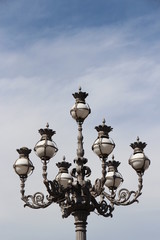 Fototapeta na wymiar Street lamp at St. Peter's Square in daylight in the Vatican City