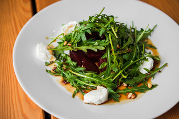 Green salad with arugula, beets and cottage cheese