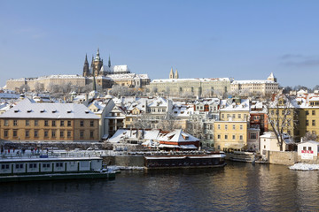 Naklejka premium Christmas Snowy Prague City with gothic Castle, Czech republic