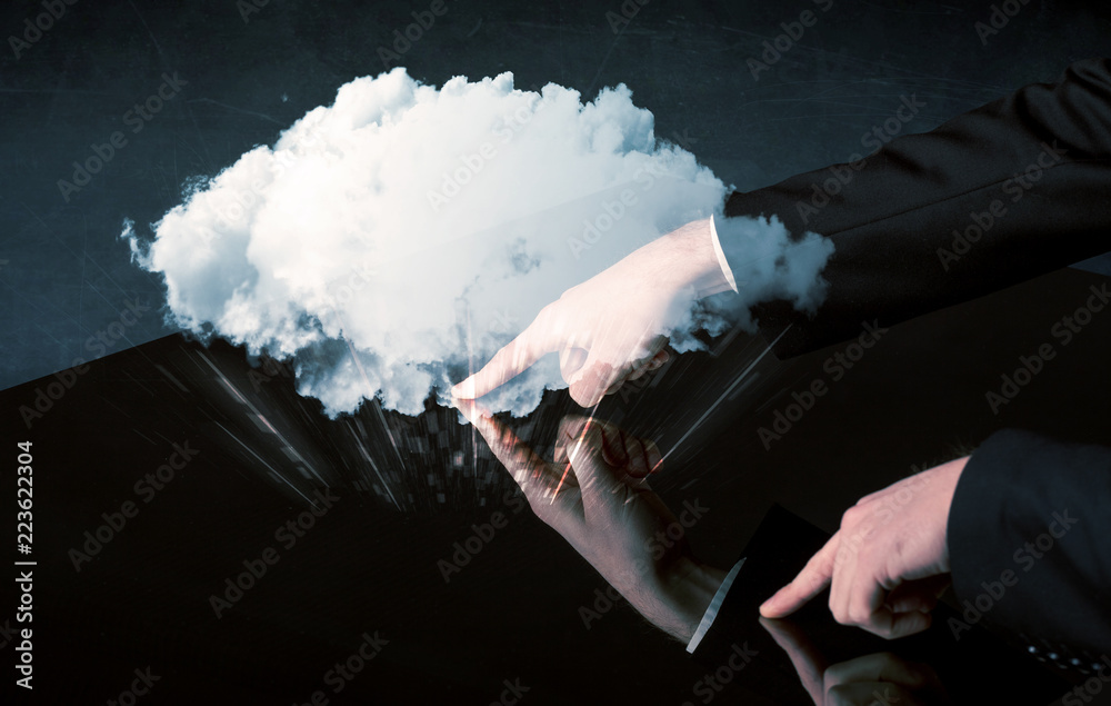Poster male hands touching interactive table with a white cloud on it