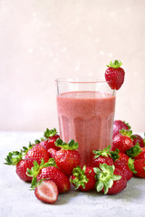 Strawberry banana smoothie in a tall glass.