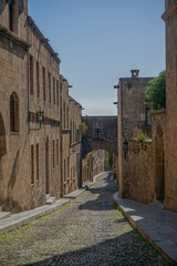 Fototapeta na wymiar Rhodes, Greece: One of the many alleyways in the 14th-century Palace of the Grand Master of the Knights of Rhodes.