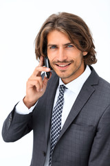 young man listening on a phone on a white background