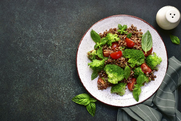 Buckwheat detox salad with broccoli and tomato.Top view with copy space.