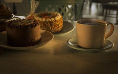 cup of coffee and cake on table