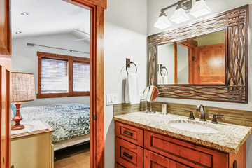 Elegant ensuite bathroom with granite counter top.