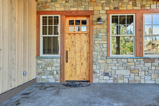 Front door entry with stone wall
