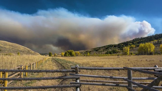Massive wildfire smoke covering a huge land area. Wyoming forest fire in Bridger-Teton National Forest. 4K time lapse.