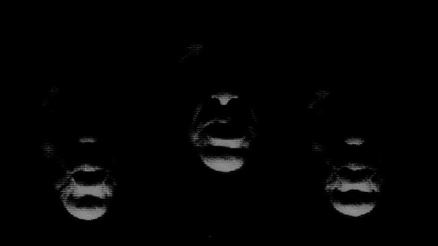 projection of the speaker's face in absolute darkness