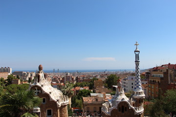 Fototapeta na wymiar Top of the two pavilions in Park Guell with Barcelona